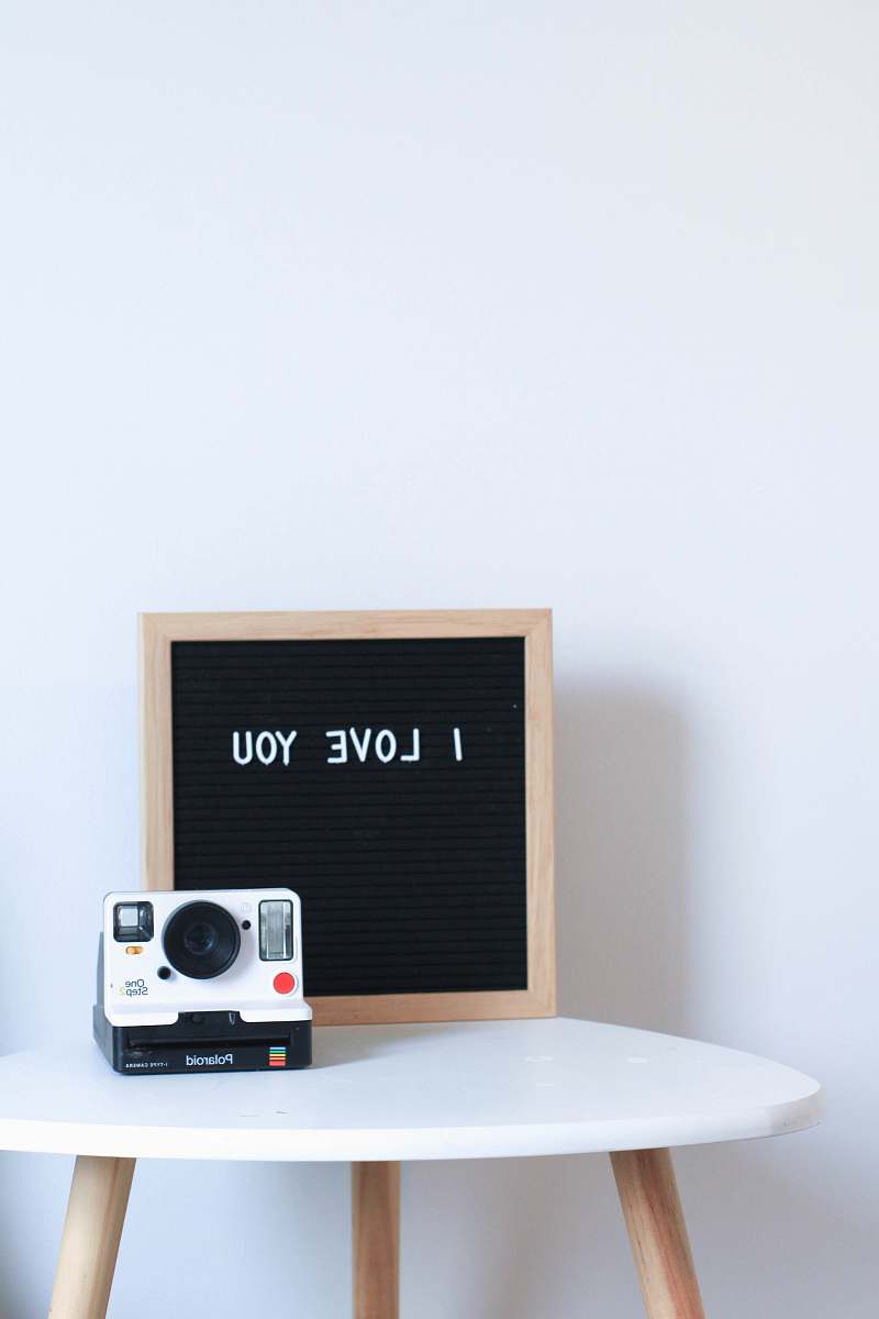 electronics white and black Polaroid instant camera camera